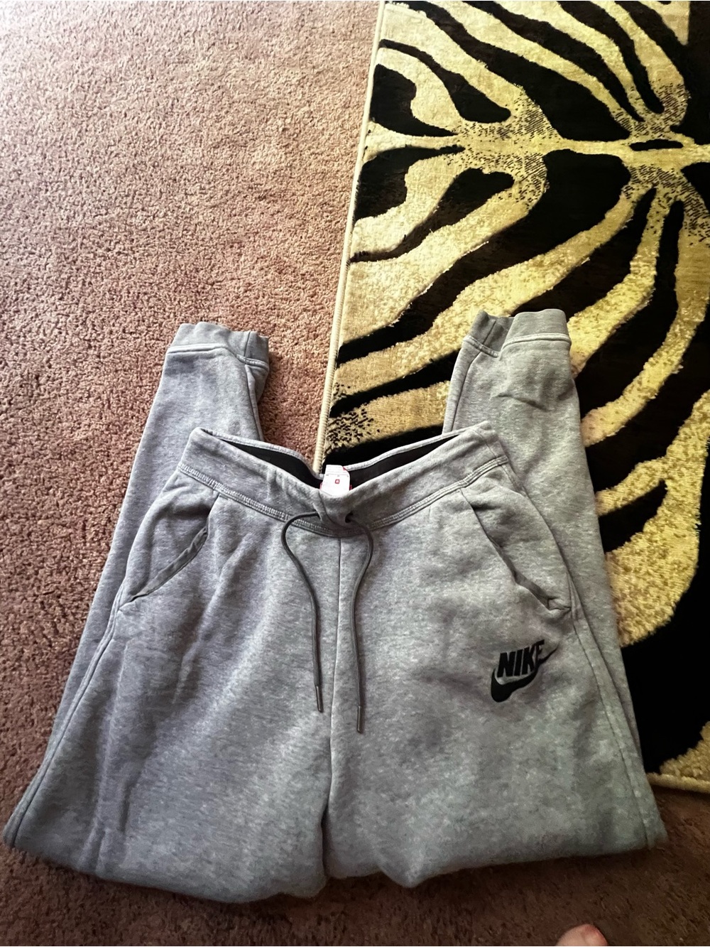 Nike joggers feature a black swoosh medium